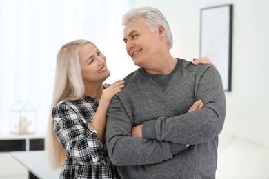 Photo of Portrait of adorable mature couple together indoors