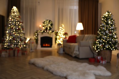 Photo of Blurred view of living room with Christmas decorations. Interior design