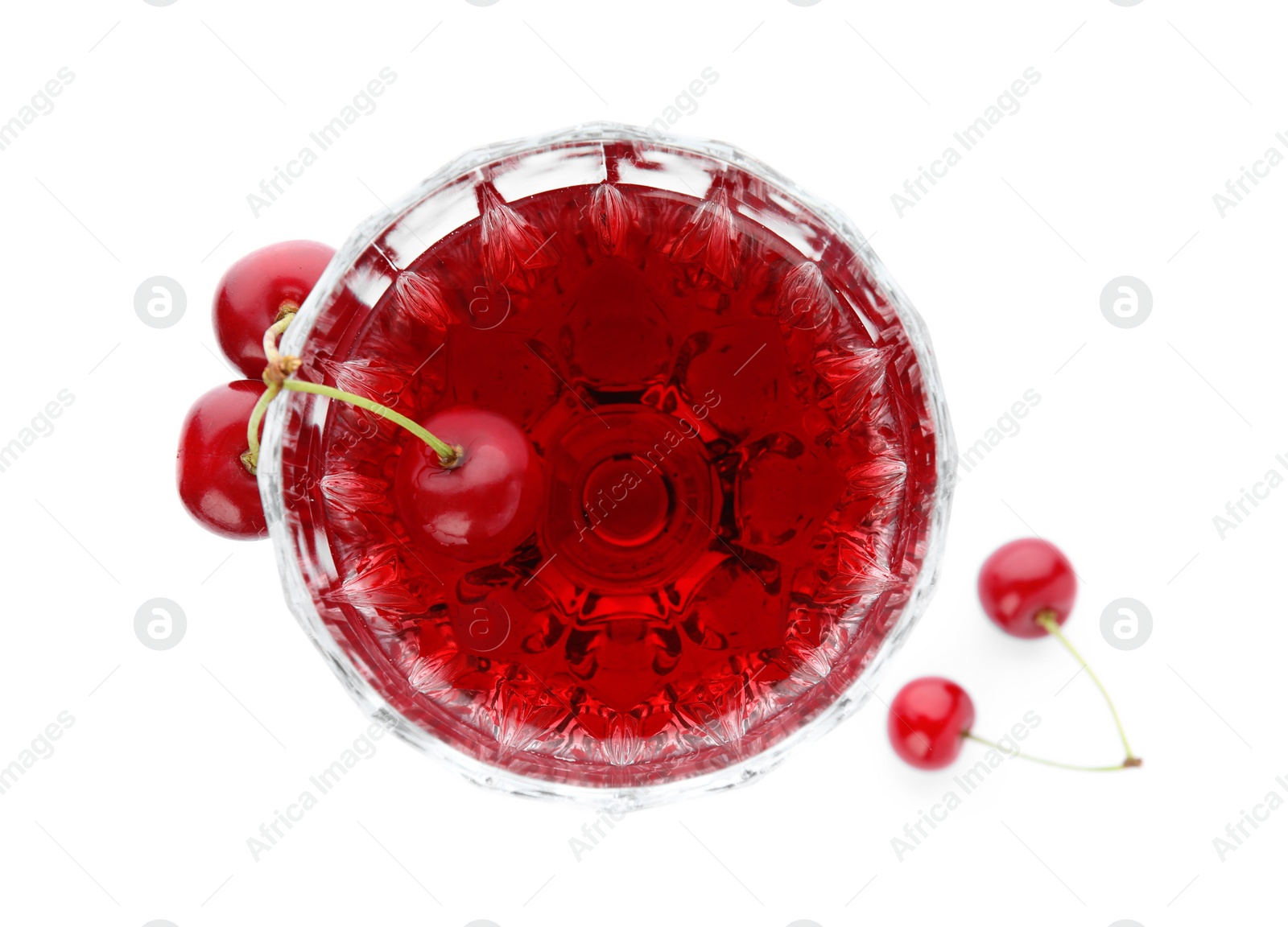 Photo of Delicious cherry wine with ripe juicy berries isolated on white, top view