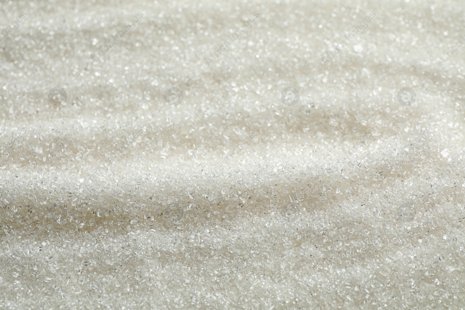 Photo of Pile of granulated sugar as background, closeup