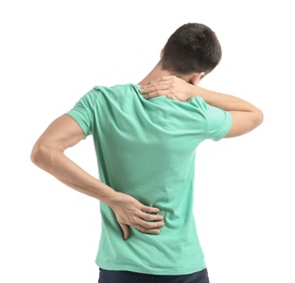 Young man suffering from back pain on white background