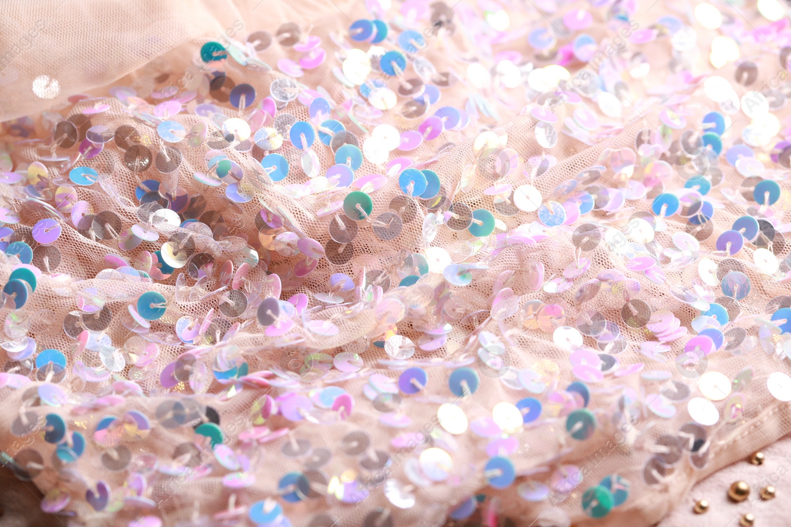 Photo of Beautiful pink fabric with shiny sequins as background, closeup