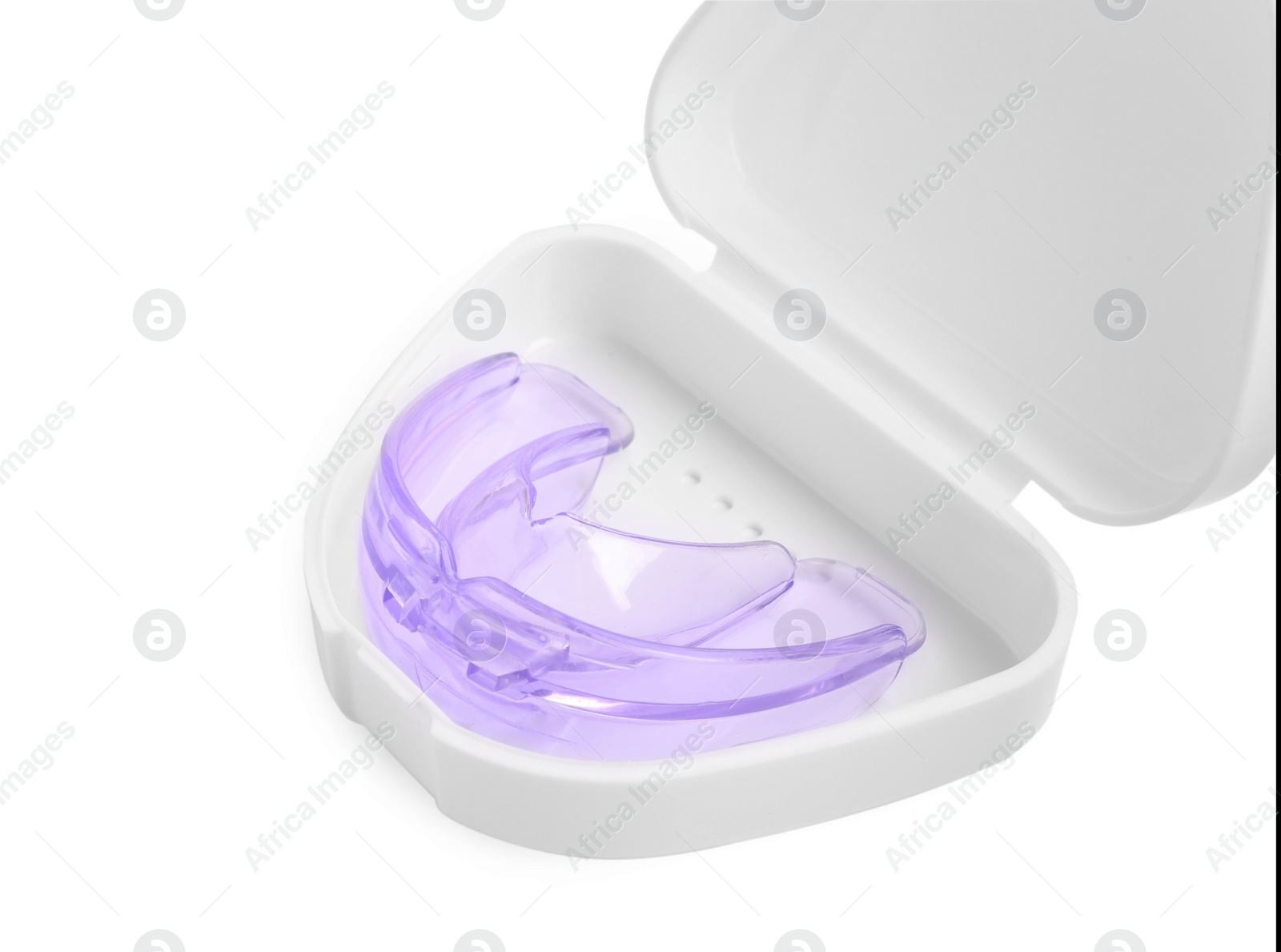 Photo of Container with transparent dental mouth guard isolated on white. Bite correction