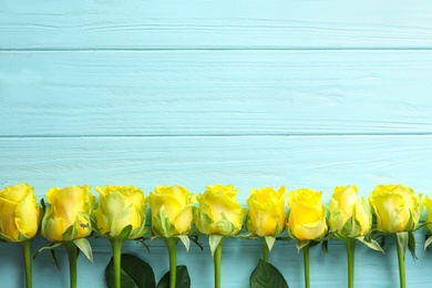 Photo of Flat lay composition with beautiful blooming flowers on wooden background