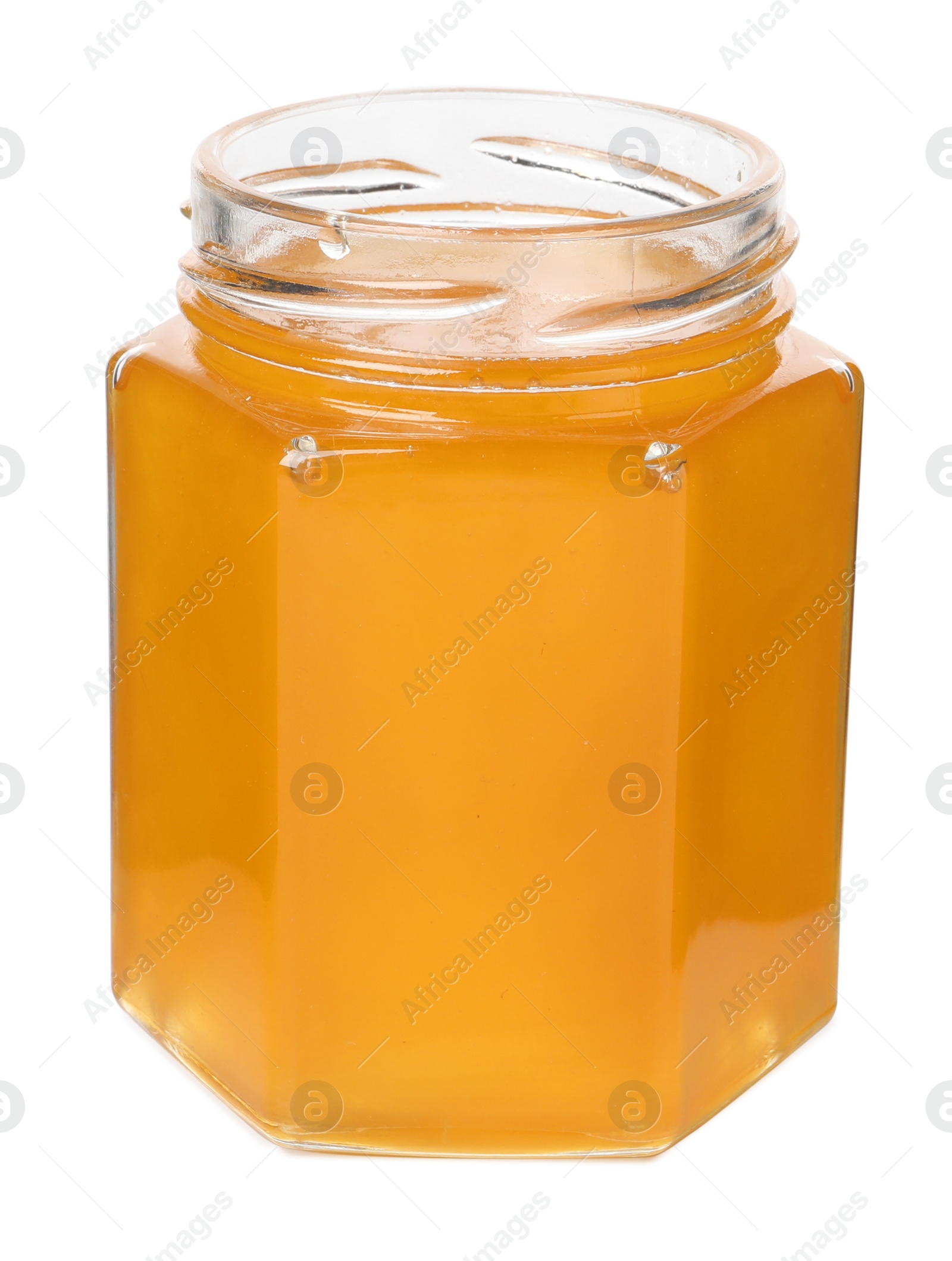 Photo of Tasty honey in glass jar isolated on white