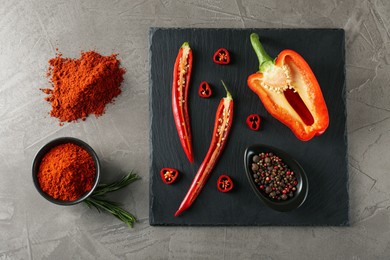 Photo of Flat lay composition with paprika powder on grey table