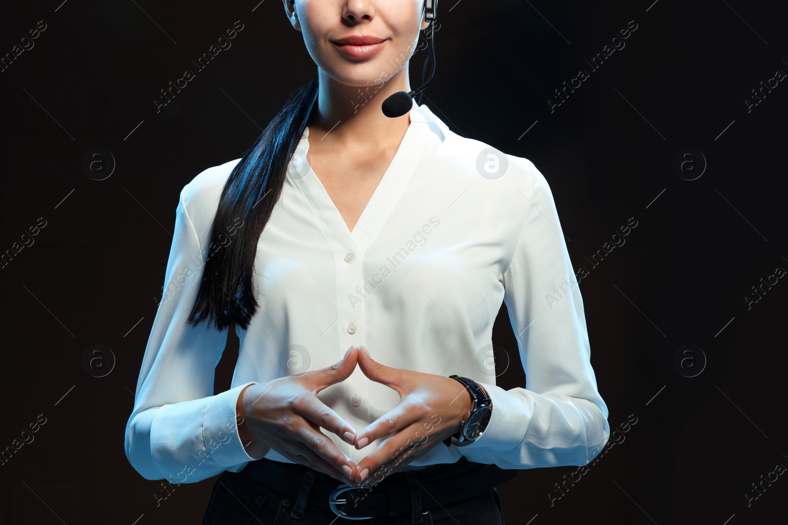 Photo of Motivational speaker with headset performing on stage, closeup