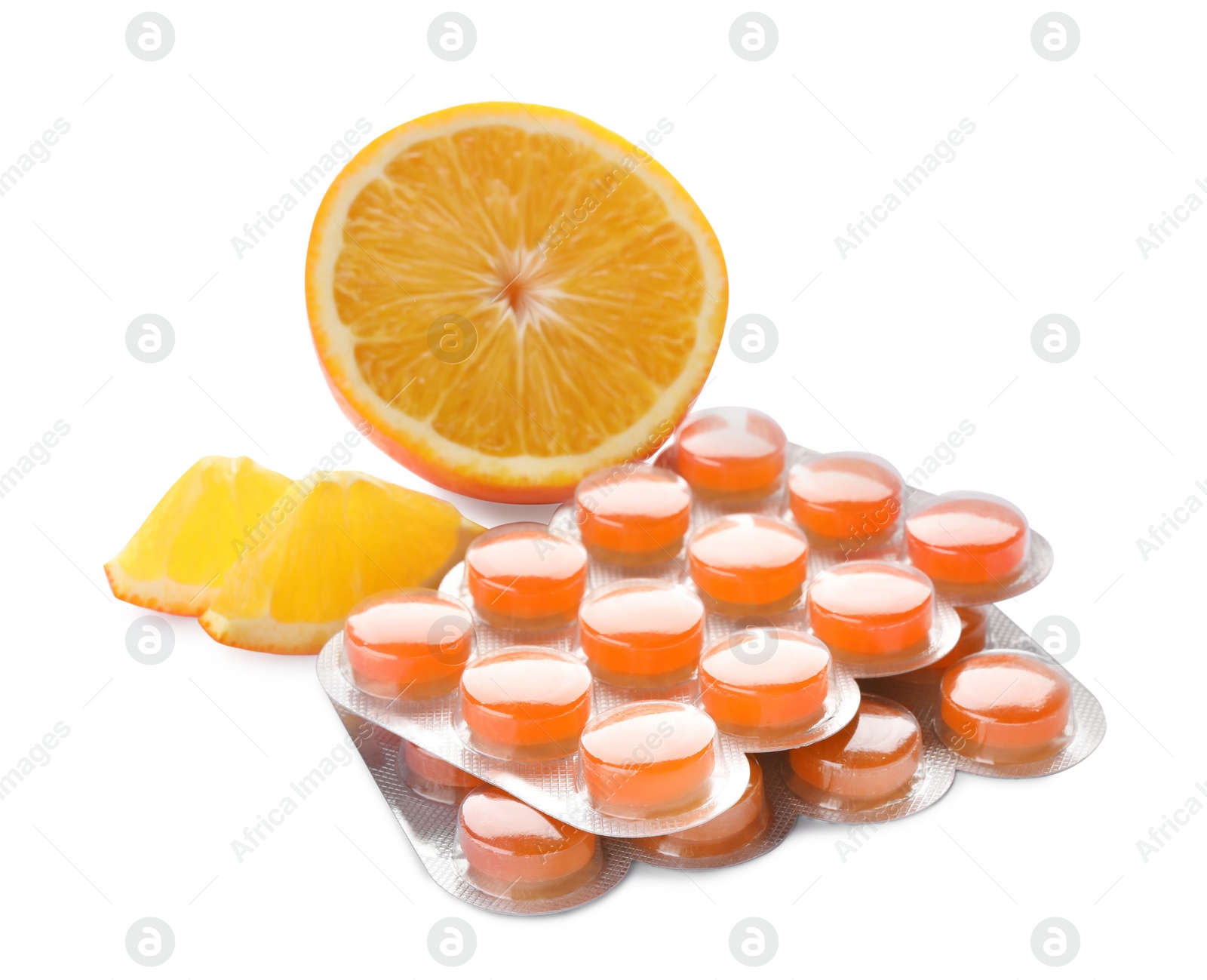 Photo of Blisters with color cough drops and orange on white background