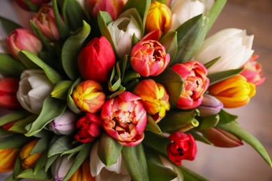 Photo of Beautiful bouquet of colorful tulip flowers, closeup