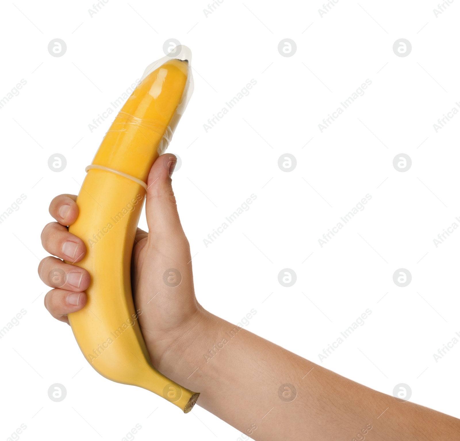 Photo of Woman holding banana in condom on white background, closeup. Safe sex concept