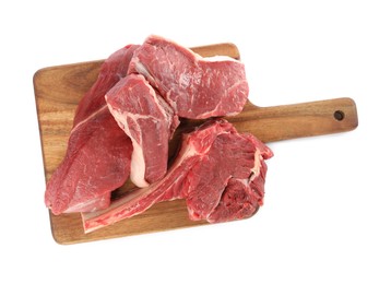 Photo of Board with pieces of raw beef meat isolated on white, top view