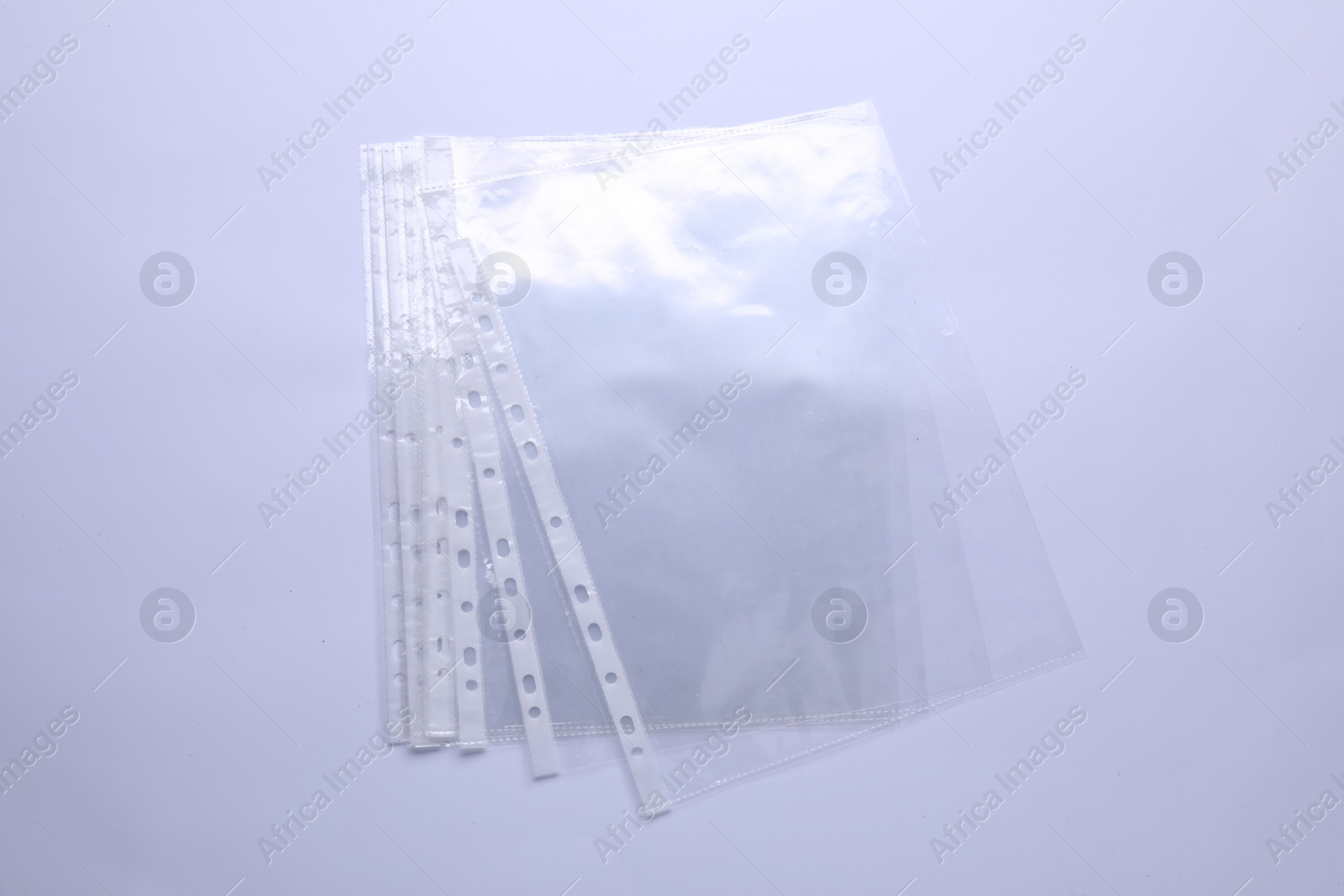 Photo of Empty punched pockets isolated on white, top view