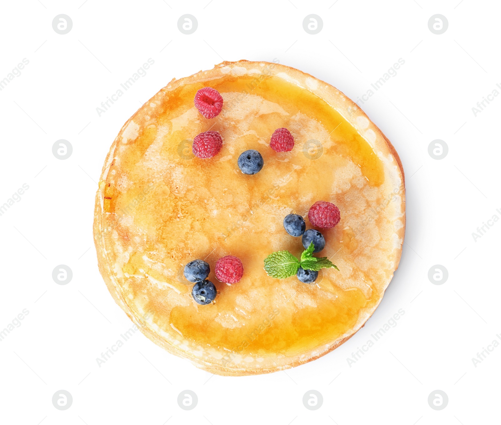 Photo of Tasty thin pancakes with maple syrup and fresh berries on white background, top view