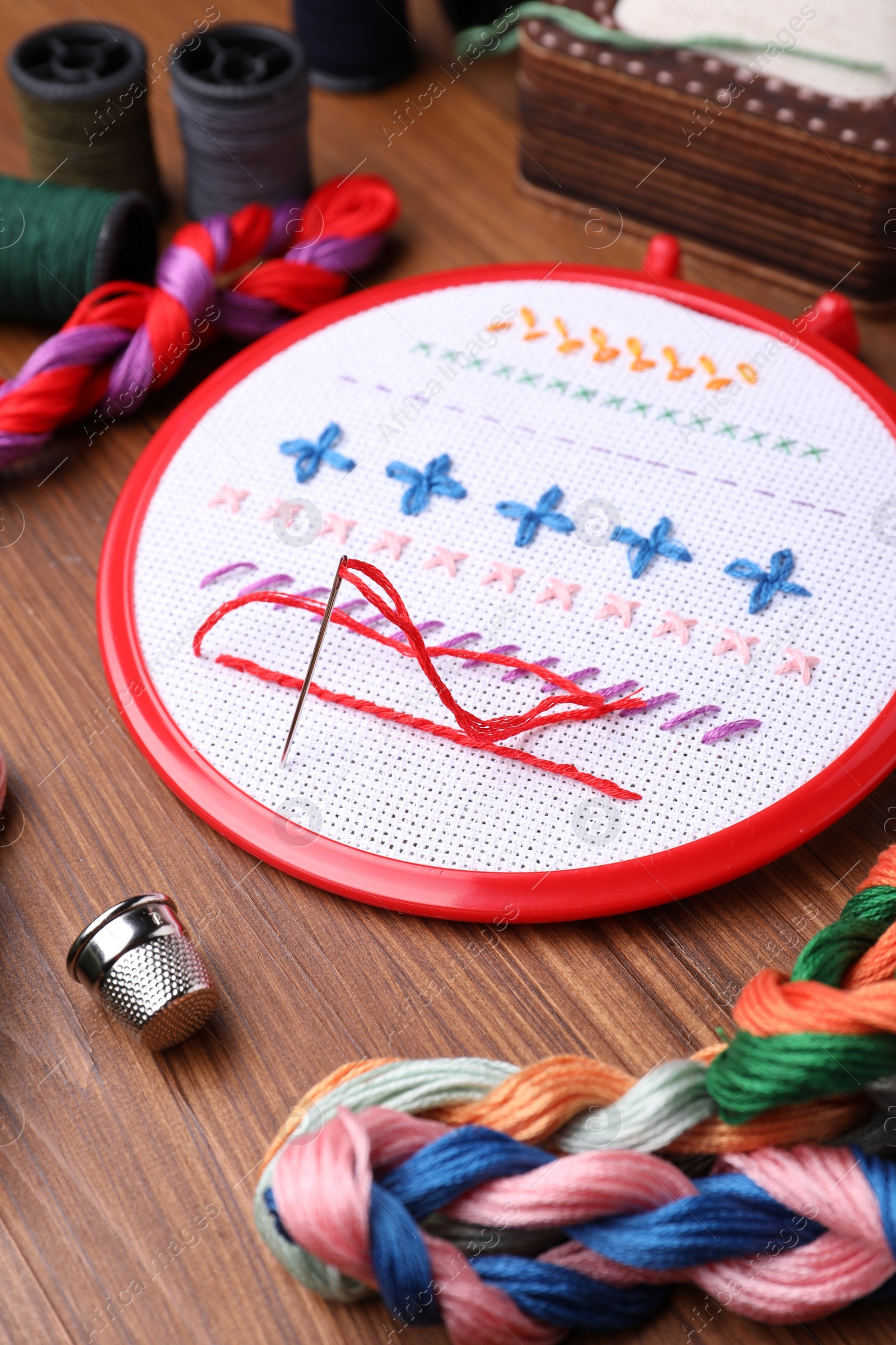 Photo of Set of embroidery equipment on wooden table