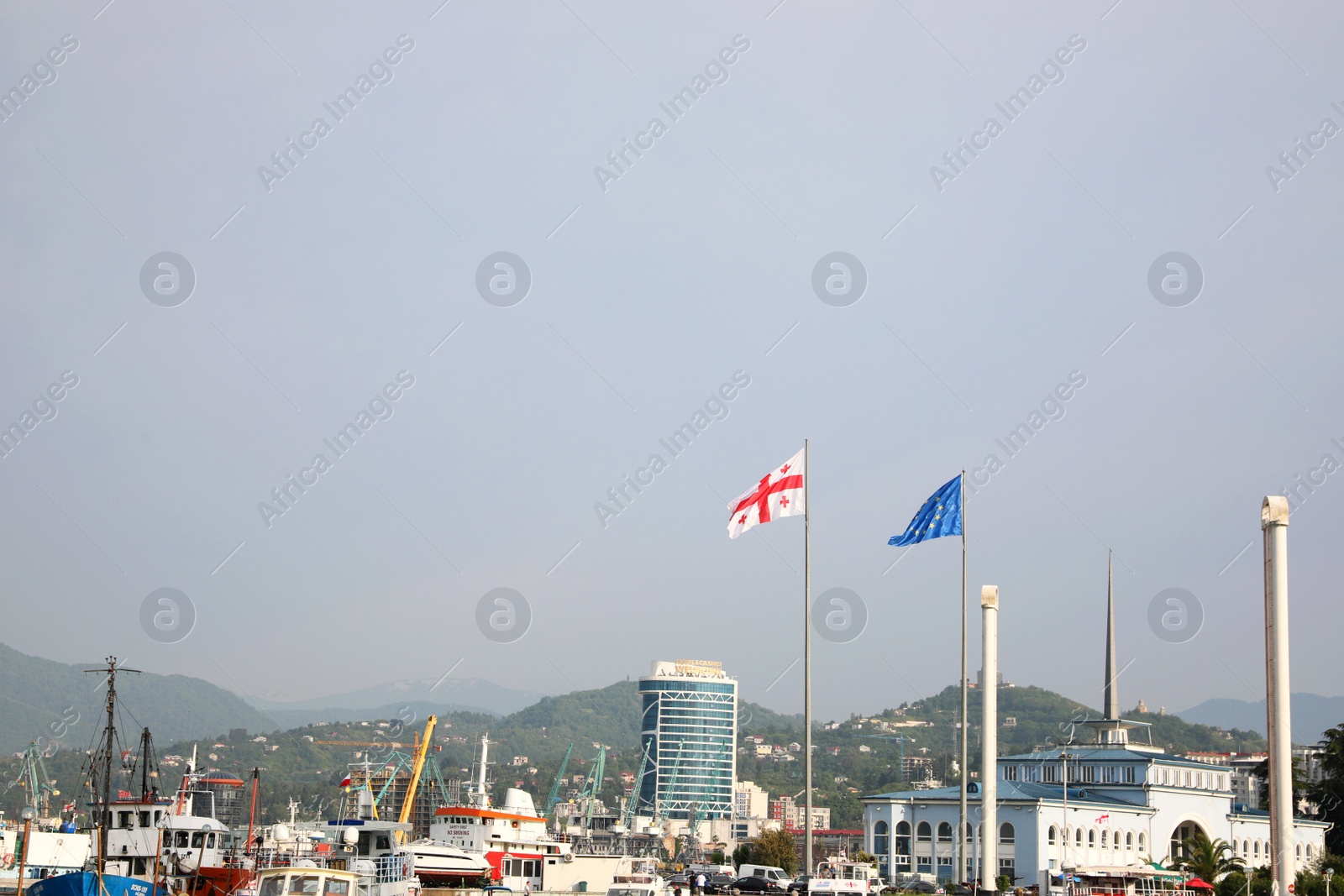 Photo of BATUMI, GEORGIA - MAY 31, 2022: Picturesque view of city with seaport on sunny day