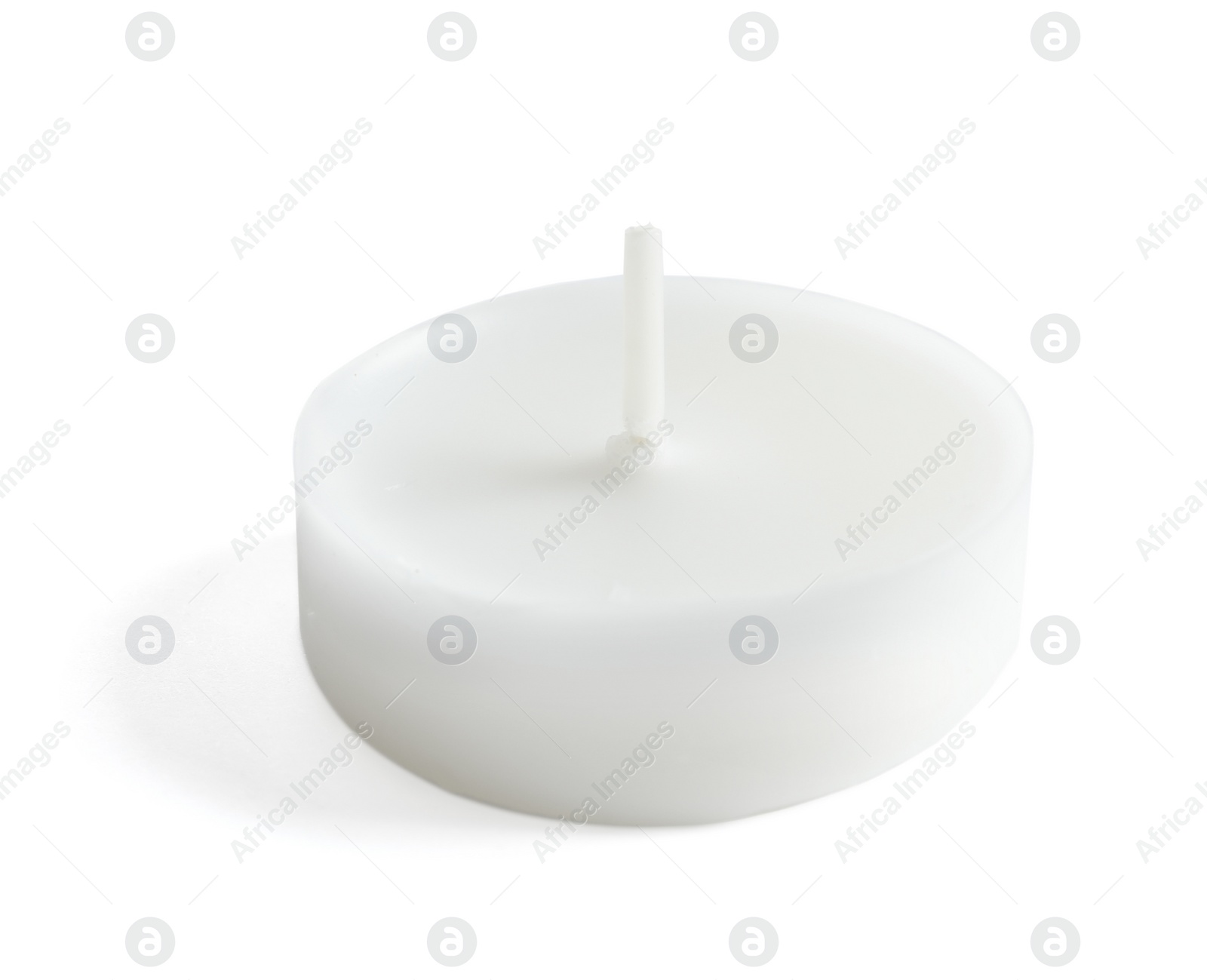 Photo of New small wax candle on white background