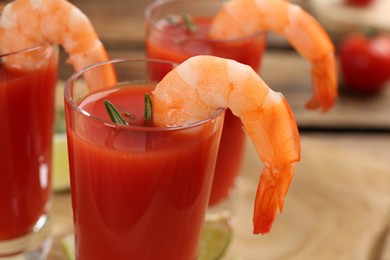 Photo of Delicious shrimp cocktail with tomato sauce, closeup