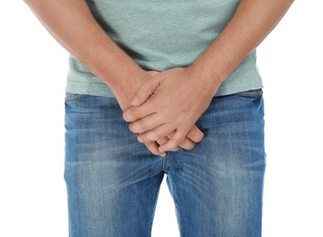 Photo of Man suffering from pain on white background, closeup. Urology problems