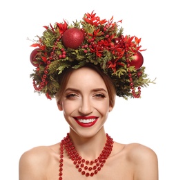 Beautiful young woman wearing Christmas wreath on white background