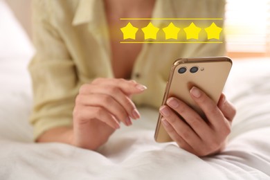 Woman with smartphone giving feedback indoors, closeup. Customer review