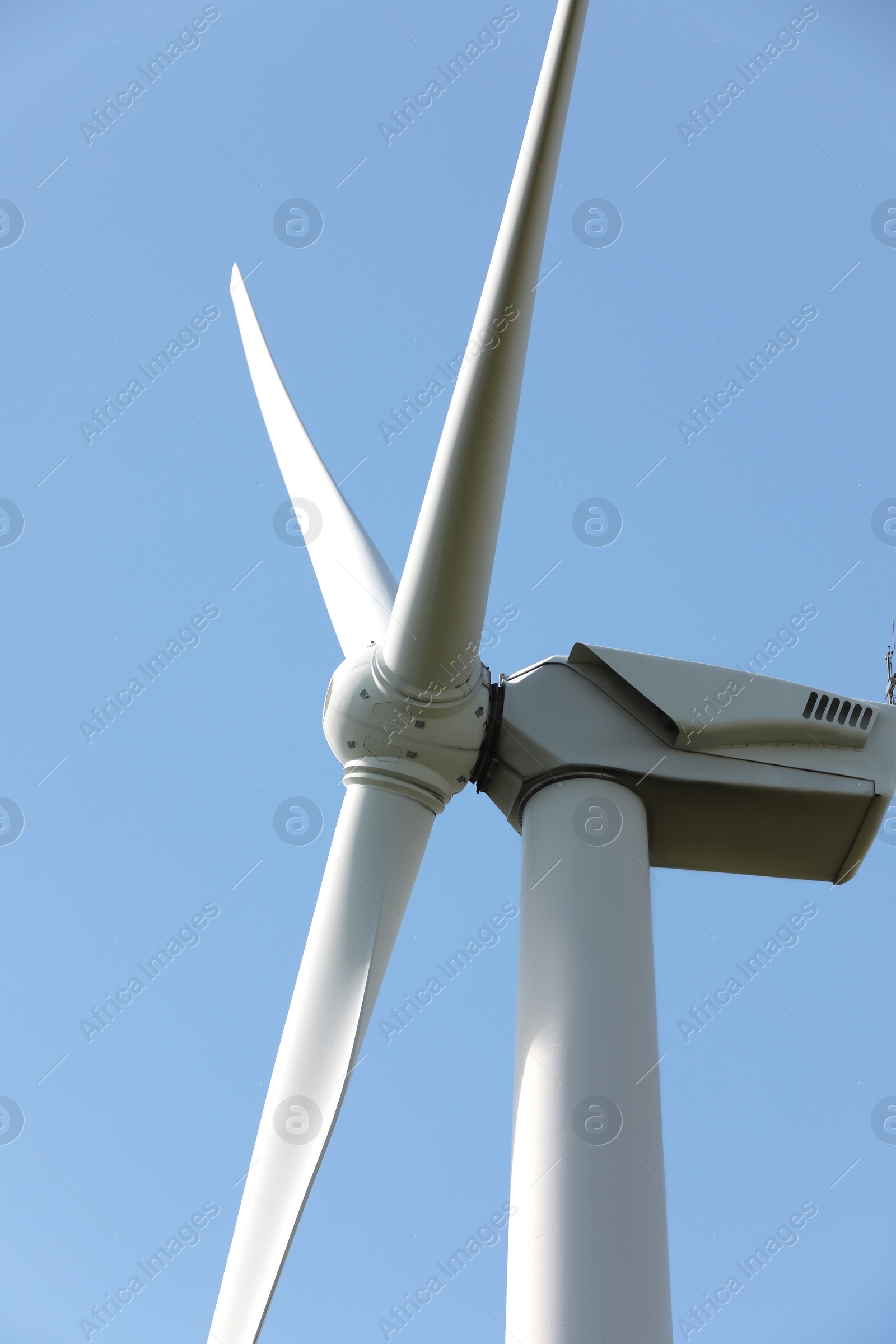 Photo of Wind turbine against beautiful sky, closeup. Alternative energy source