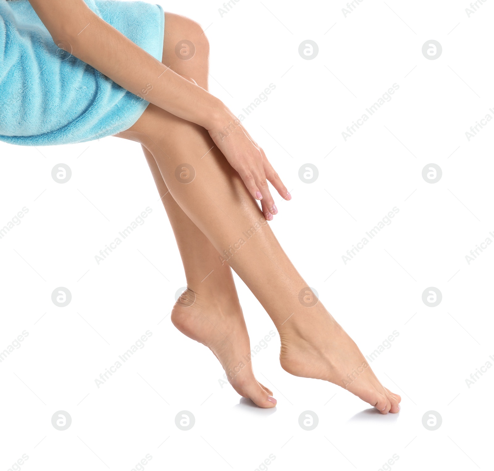 Photo of Woman with beautiful legs and feet on white background, closeup. Spa treatment