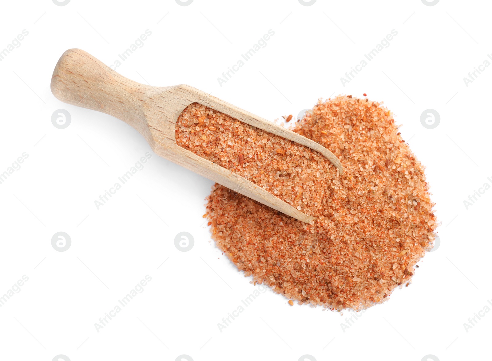 Photo of Wooden scoop with pink salt on white background, top view