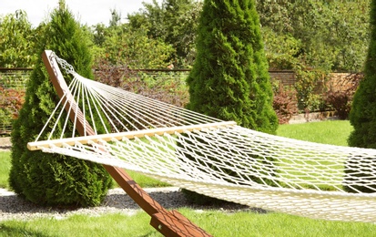 Empty comfortable hammock outdoors on sunny day