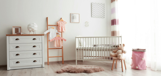 Image of Baby room interior with comfortable crib. Banner design