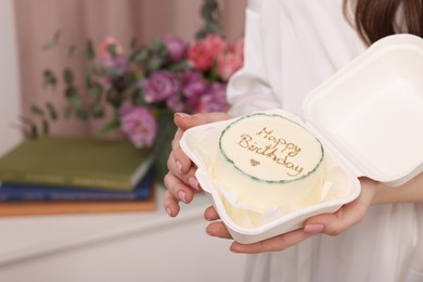 Photo of Woman holding her Birthday cake indoors, closeup and space for text