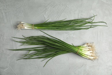 Fresh green onion on table, top view