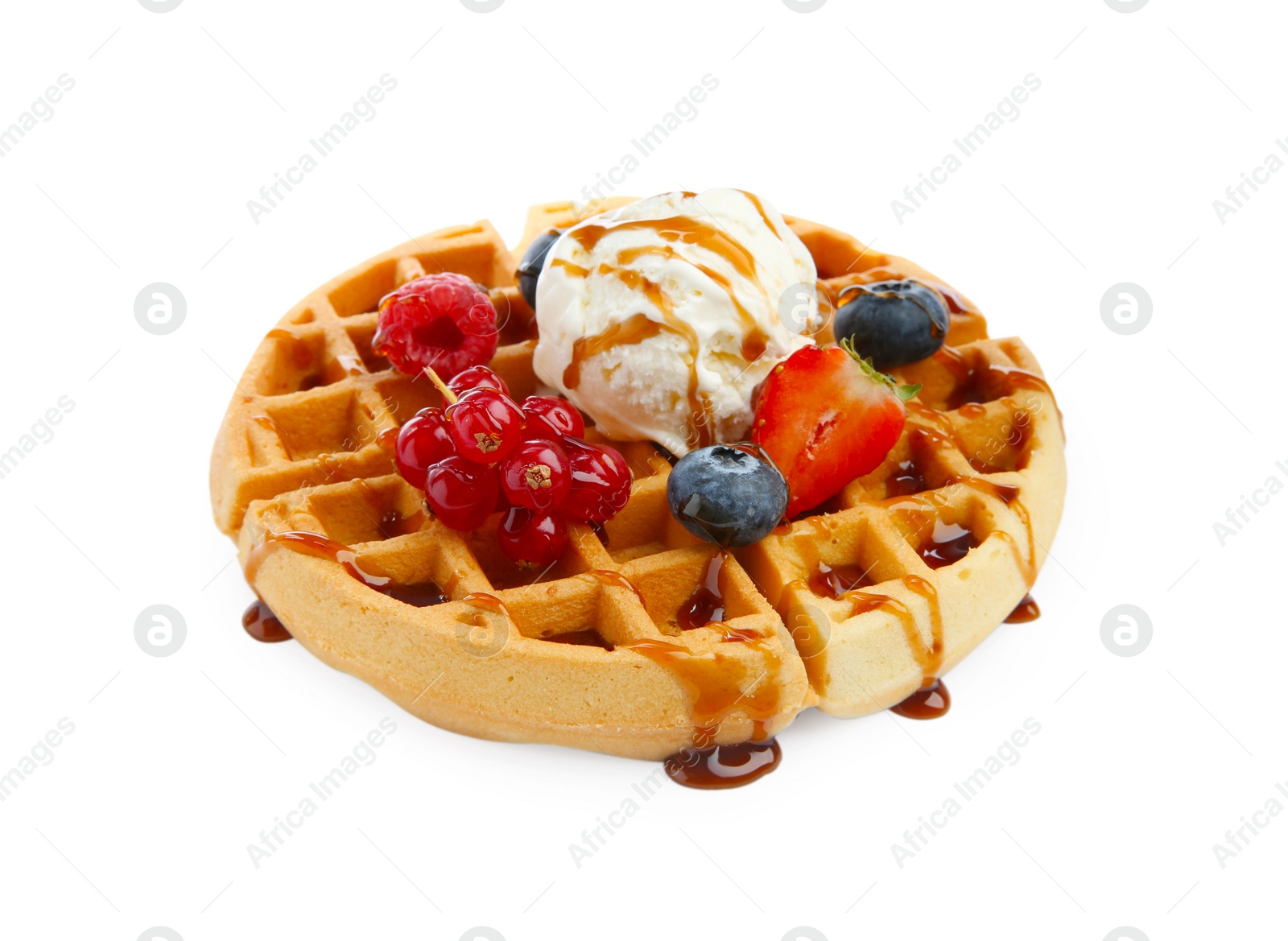 Photo of Tasty Belgian waffle with ice cream, berries and caramel syrup on white background