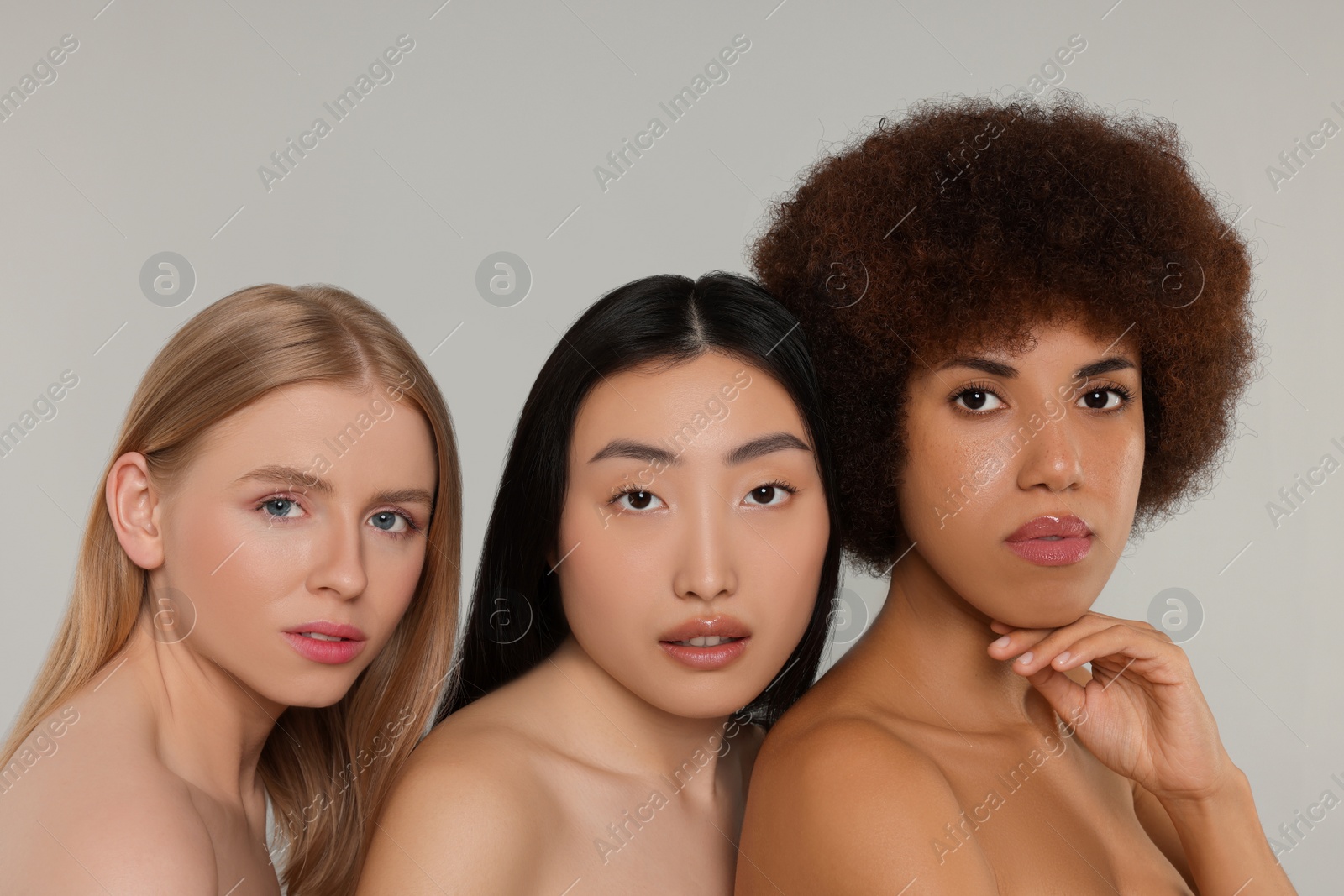 Photo of Portrait of beautiful young women on light grey background