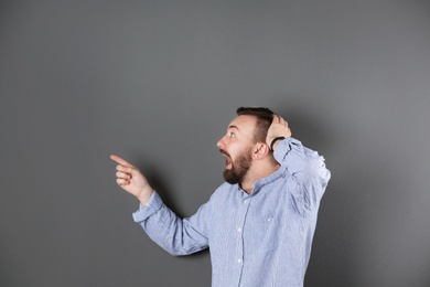 Portrait of handsome bearded man on color background