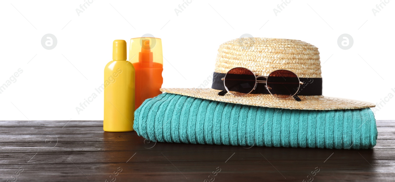 Photo of Composition with different beach objects on wooden table, white background