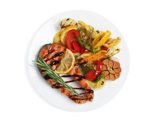 Photo of Tasty salmon steak with sauce, lemon and vegetables on white background, top view