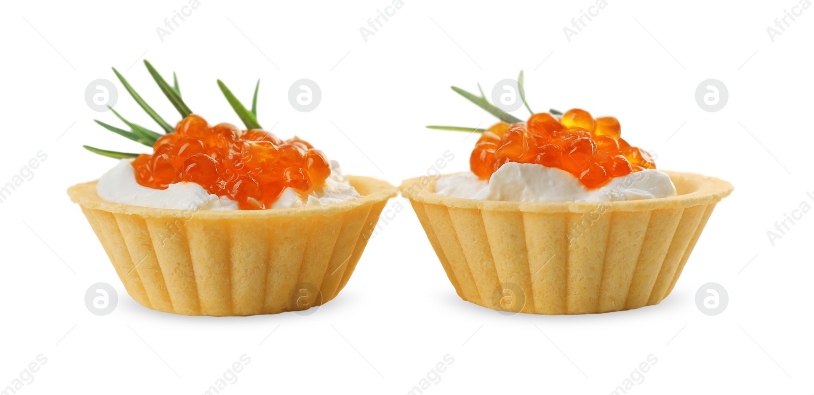 Photo of Delicious tartlets with red caviar and cream cheese on white background