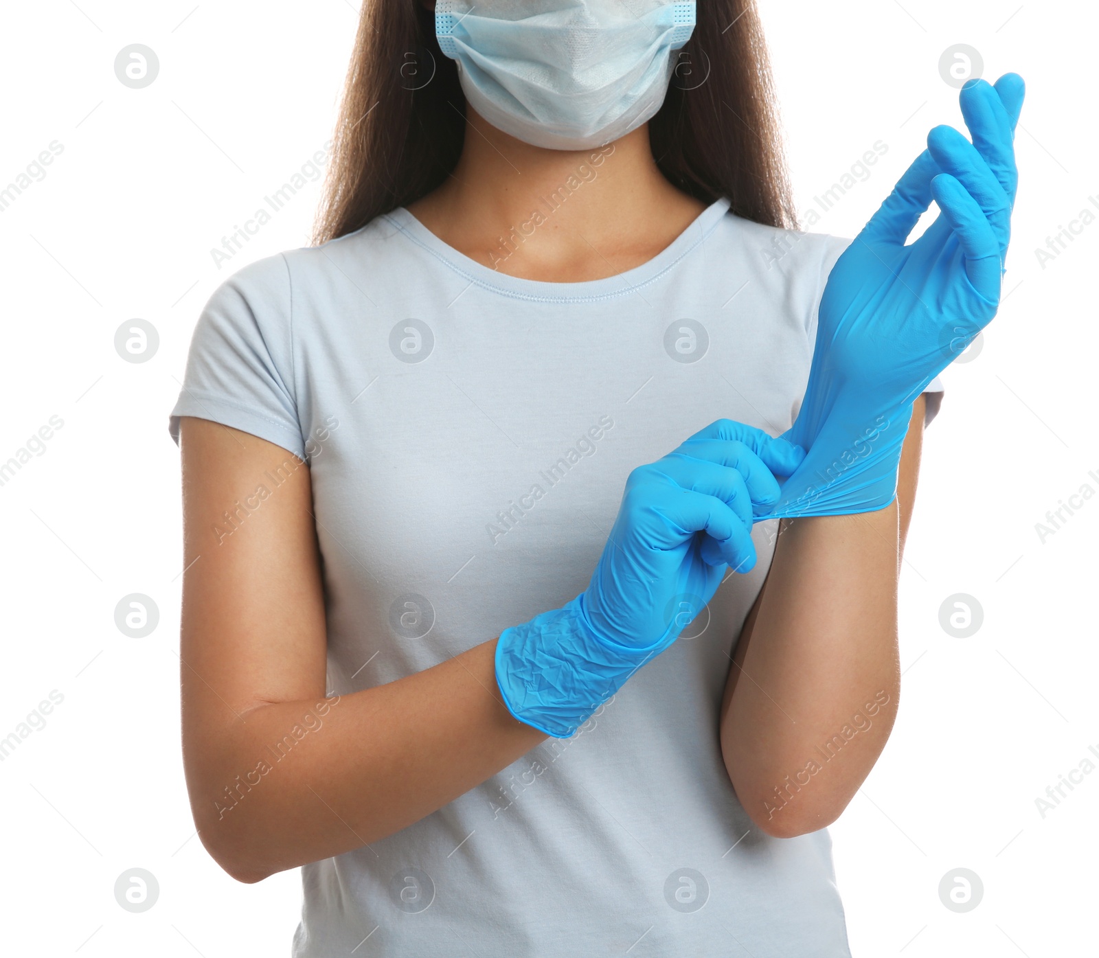 Photo of Woman in protective face mask putting on medical gloves against white background, closeup