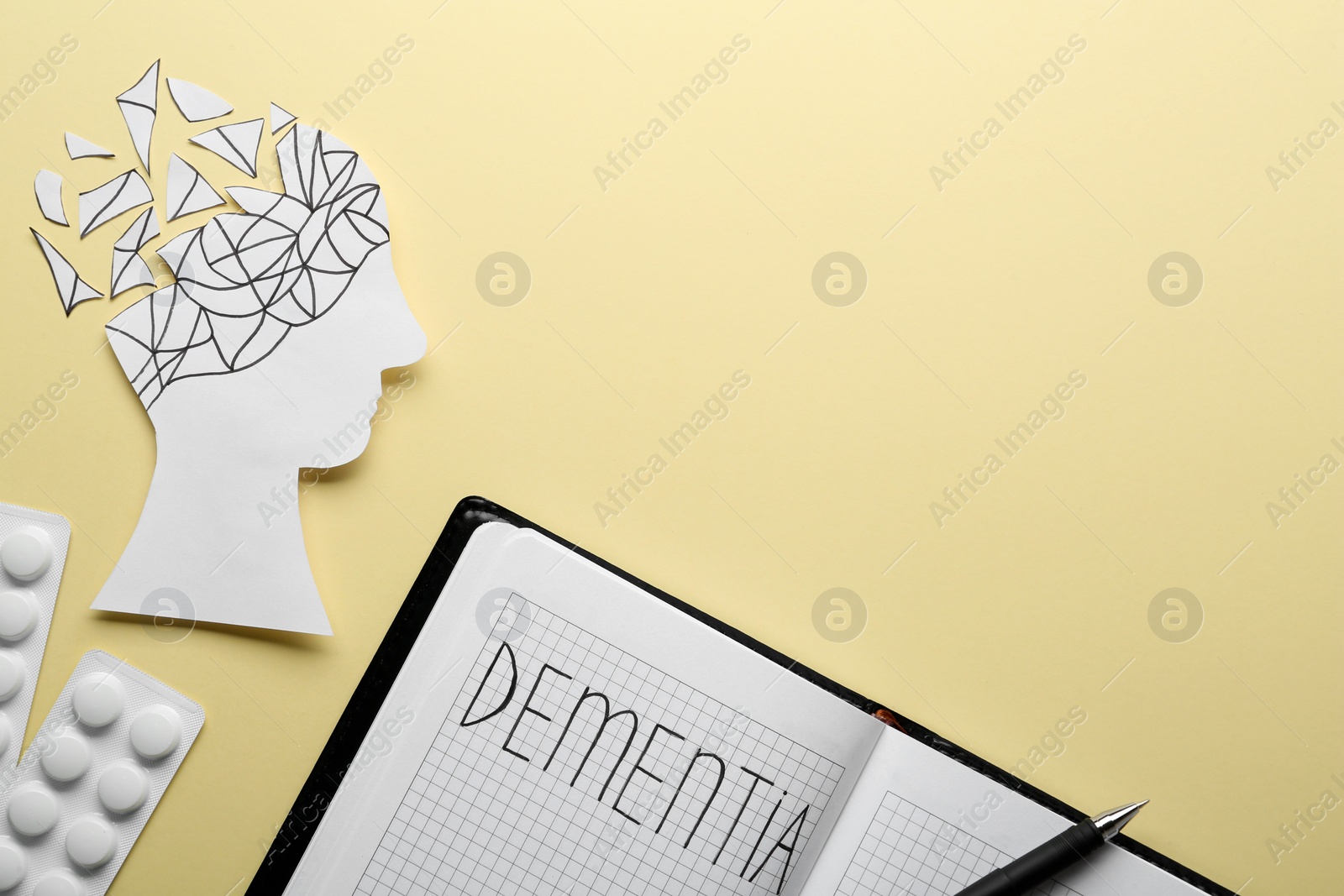 Photo of Flat lay composition of notebook with word Dementia on beige background, space for text