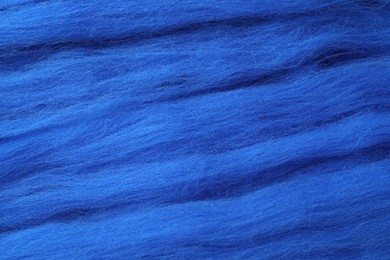 Photo of Blue felting wool as background, closeup view