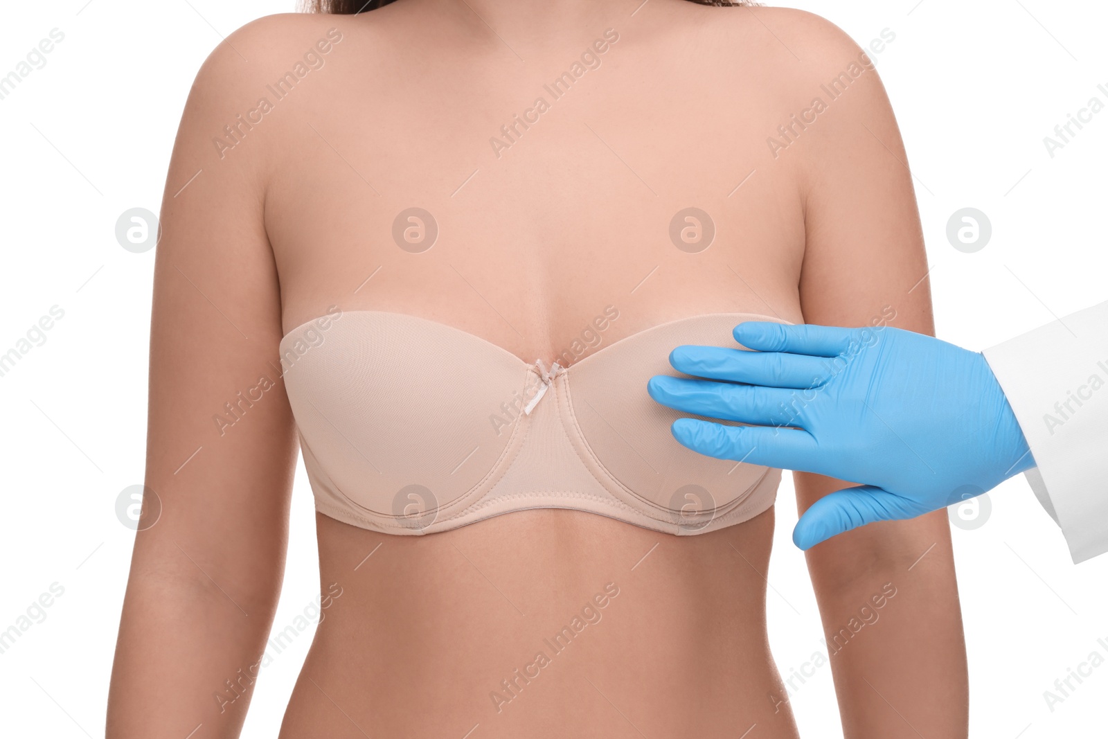 Photo of Mammologist checking woman's breast on white background, closeup