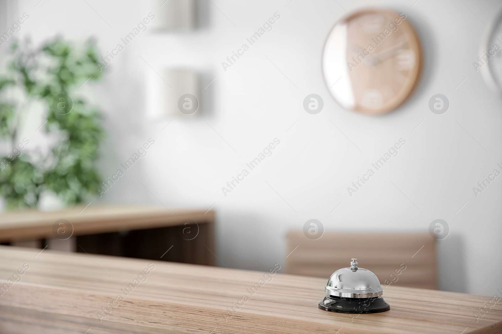 Photo of Service bell on reception desk in hotel, closeup