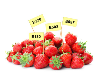 Image of Ripe strawberries with E numbers on white background. Harmful food additives 