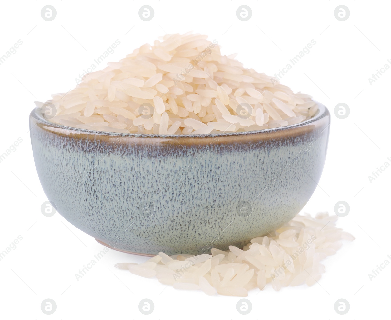 Photo of Raw rice in bowl isolated on white