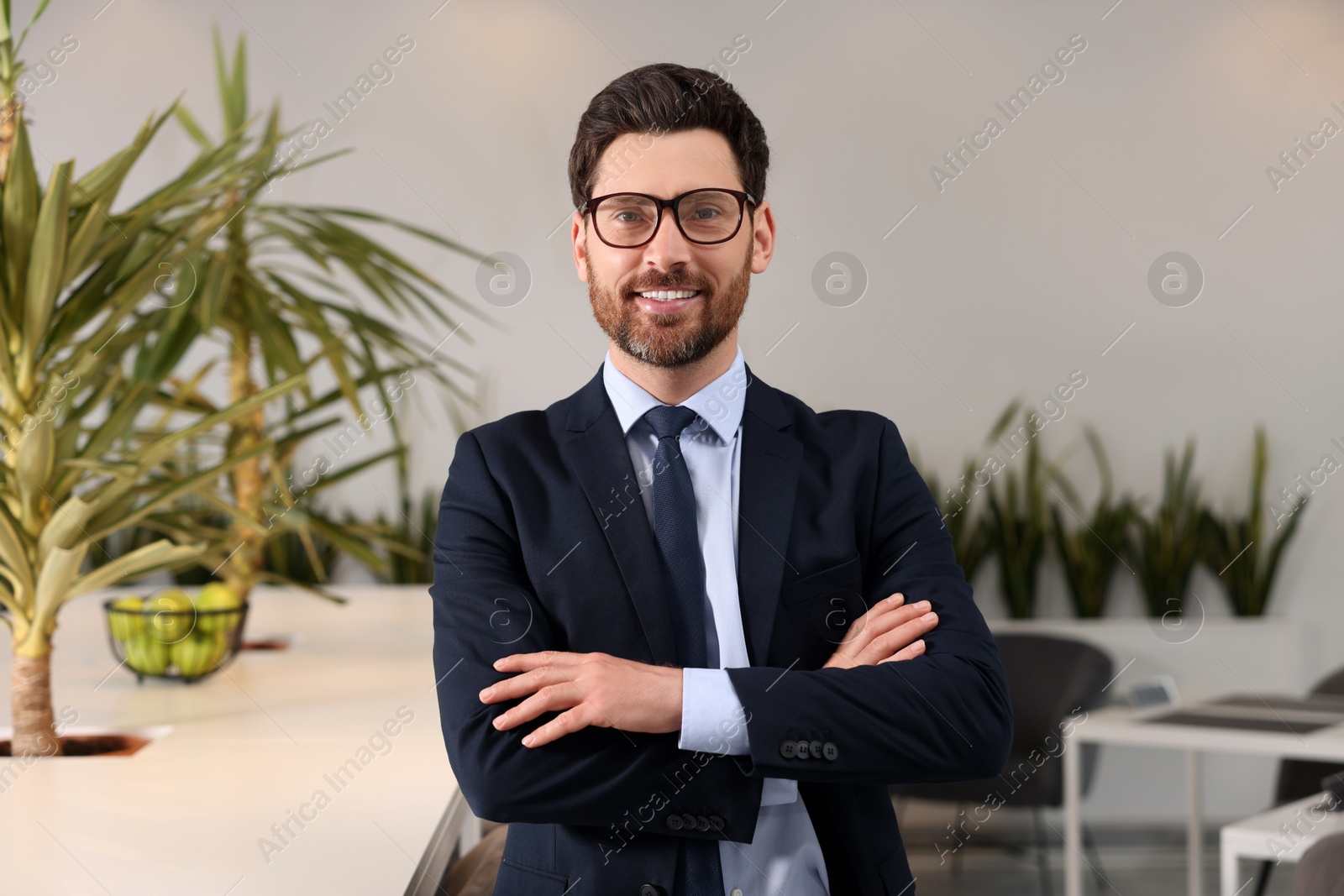 Photo of Confident male real estate agent in office