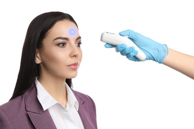 Image of Doctor measuring woman's temperature on white background, closeup. Prevent spreading of Covid-19