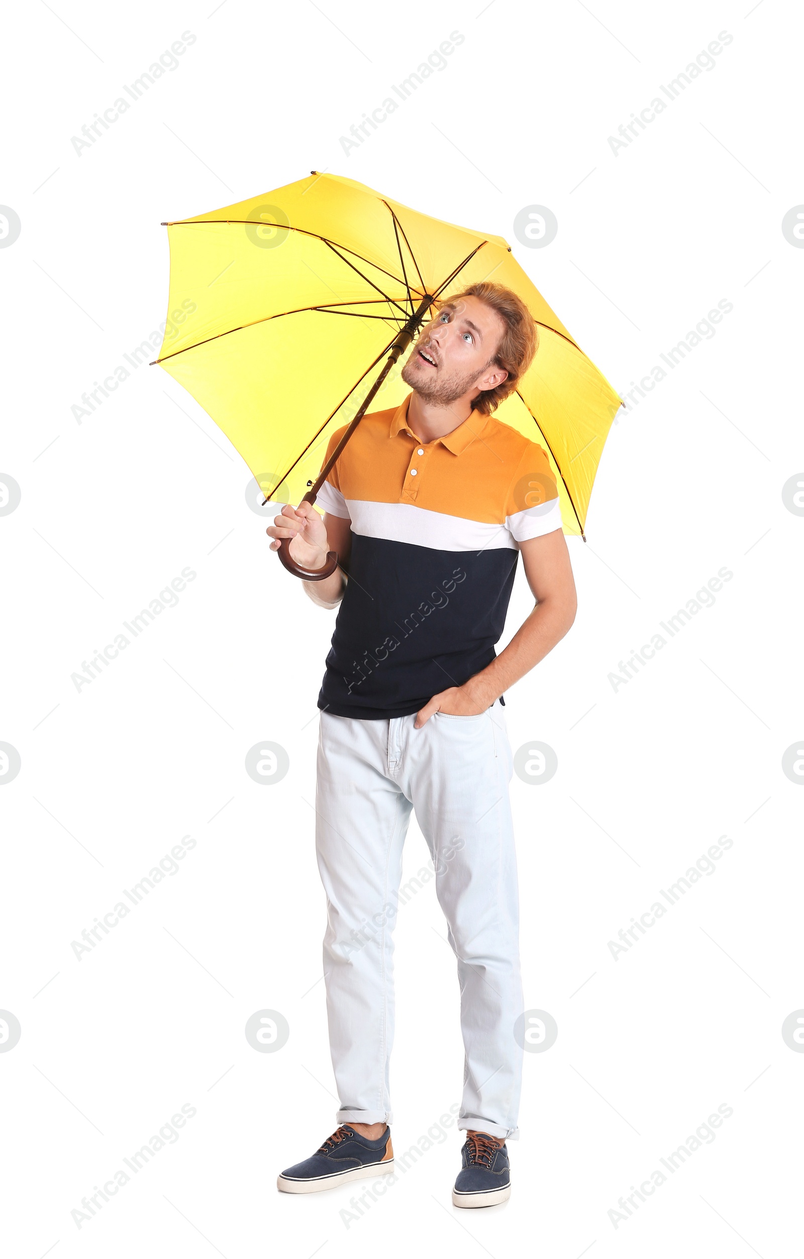 Photo of Man with yellow umbrella on white background