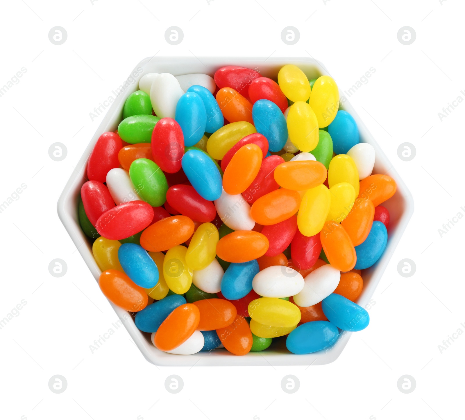 Photo of Bowl of tasty jelly beans on white background, top view