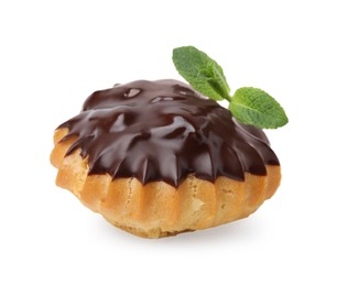 One delicious profiterole with chocolate spread and mint isolated on white