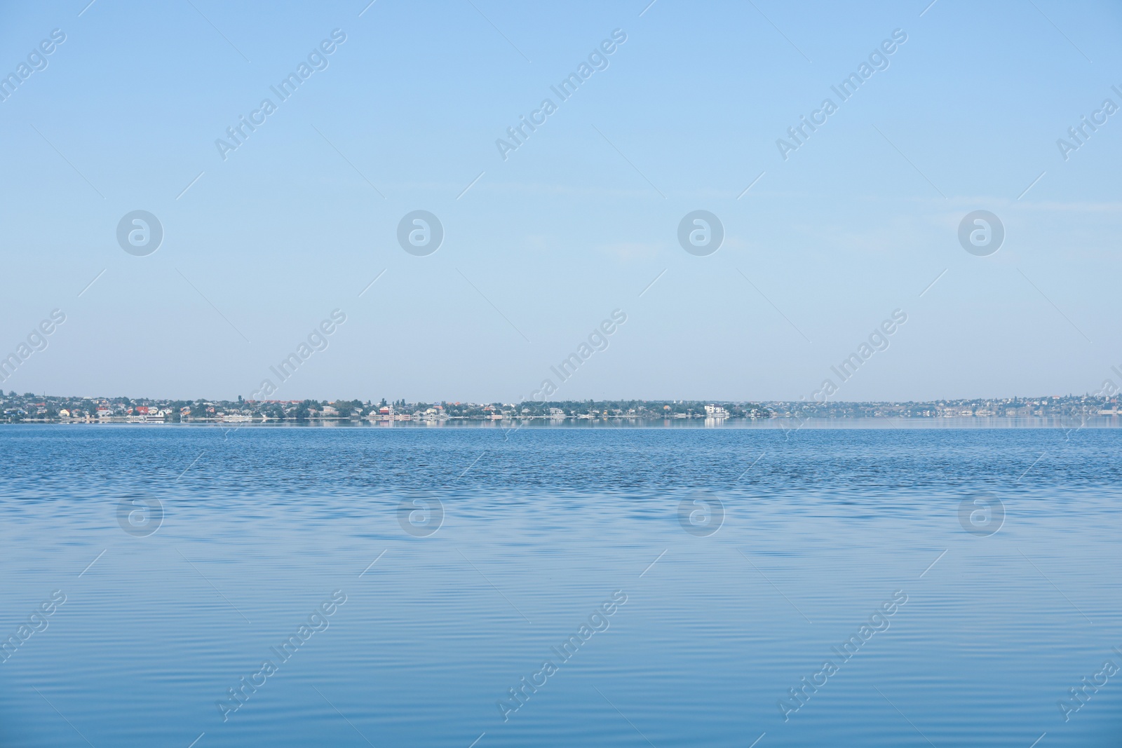 Photo of Picturesque view of calm river under blue sky
